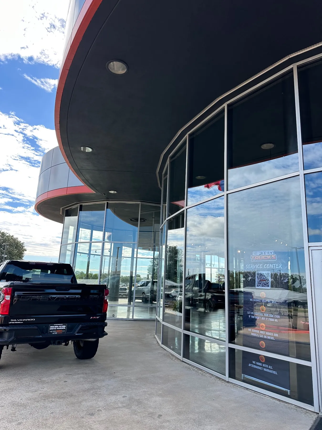 Large curved dealership glass facade
