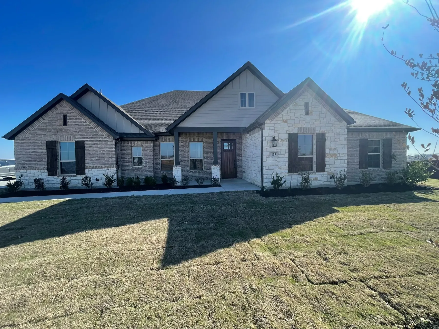 Residential brick and stone property with clean windows